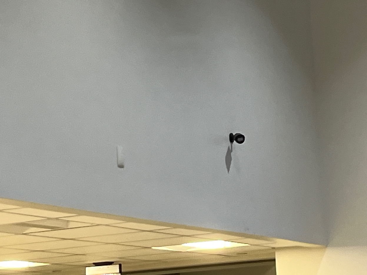 Wall mounted security camera above showroom commercial property Dutchess County NY